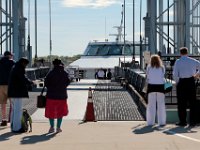 1008280152 ma nb NantucketFerry  Passengers look on as the ferry prepares to board its first passengers for the maiden voyage of the Seastreak Whaling City Express ferry service from New Bedford to Nantucket.   PETER PEREIRA/THE STANDARD-TIMES/SCMG : ferry, waterfront, voyage, trip, harbor